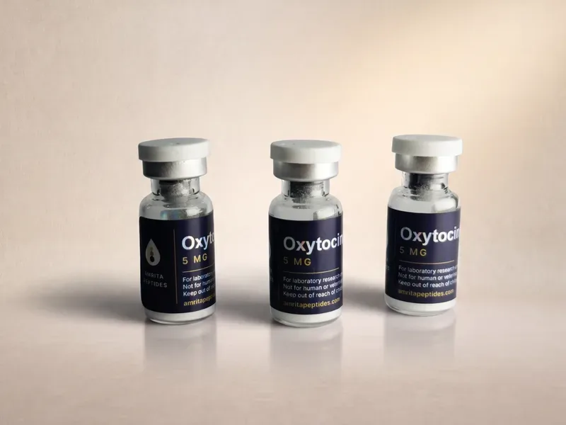 Amrita Peptides labeled Oxytocin 5 mg research peptide vials, three upright with silver caps